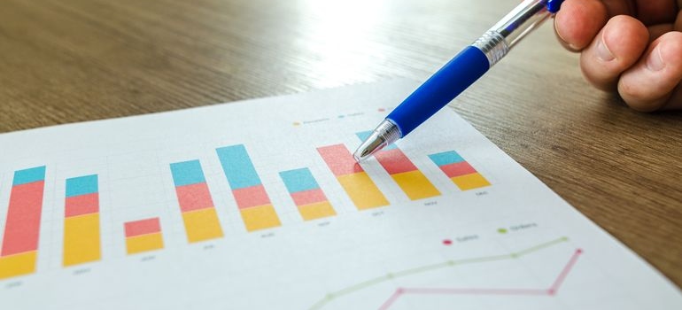 Pen pointing to statistics regarding men and alcoholism.