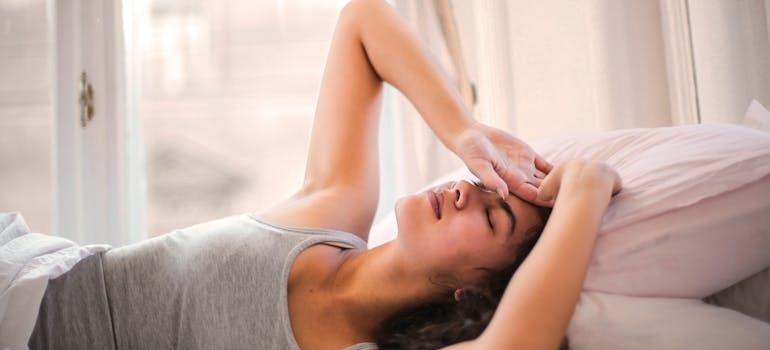 Woman experiencing sleep issues while detoxing.