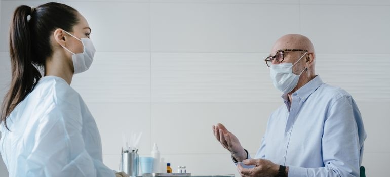 Male patient speaking with a healthcare professional about alcohol-related dementia.
