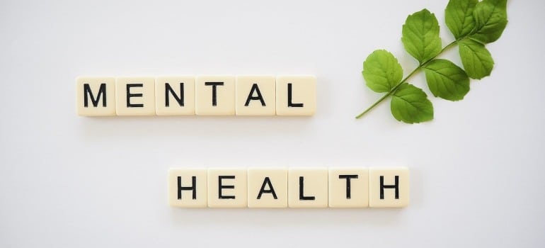 The phrase mental health written with cubes.