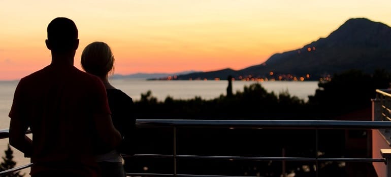 Couple watching sunset when dating a recovering addict.