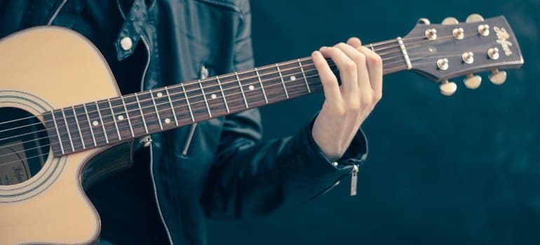 A man playing a guitar.