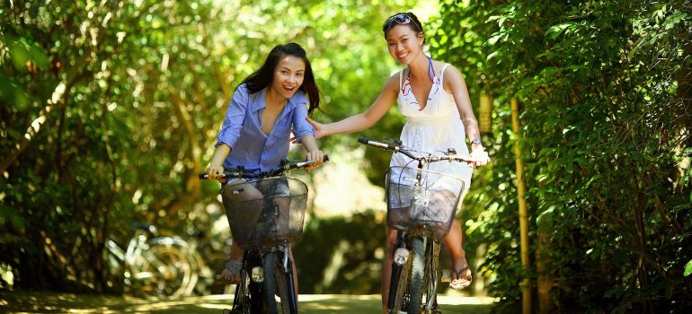 Two girls on bikes.