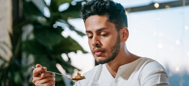 Man eating a balanced healthy meal at home.