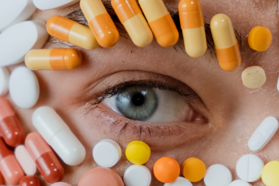 a person's eye surrounded by medications