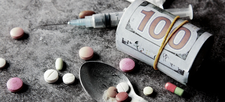 syringe, medications, and pills
