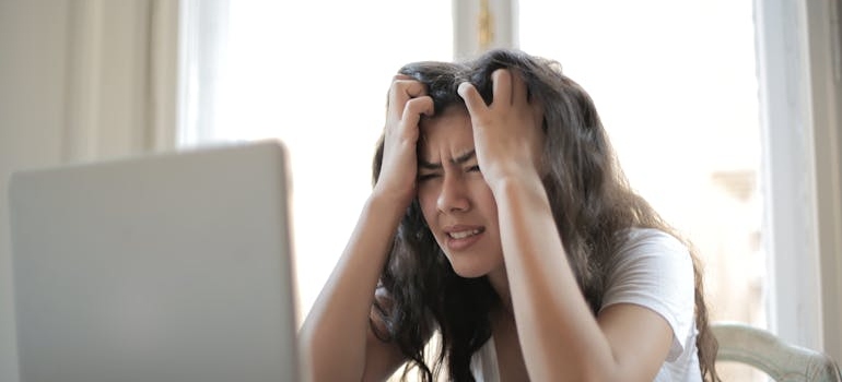 Woman stressing about whether you can keep your PA job while going to rehab.