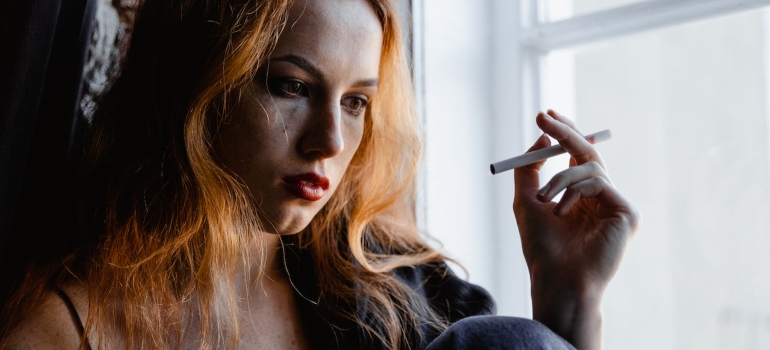 a girl smoking a cigarette