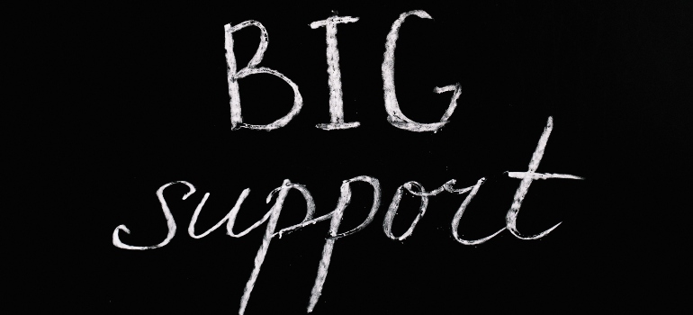 the words "big support" on a blackboard