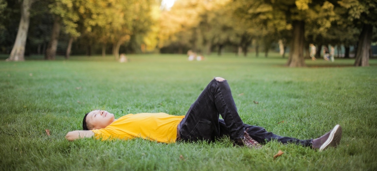 person lying on the grass