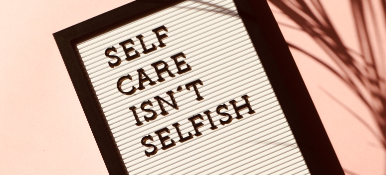 a sign saying self care isnt selfish