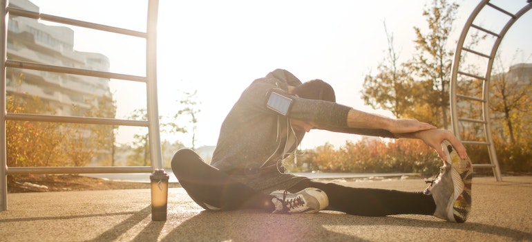 Man stretching outdoors.