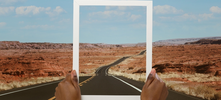 A picture frame over a long road