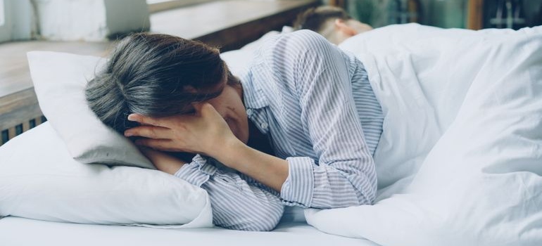 Woman feeling anxious and restless after drinking alcohol.