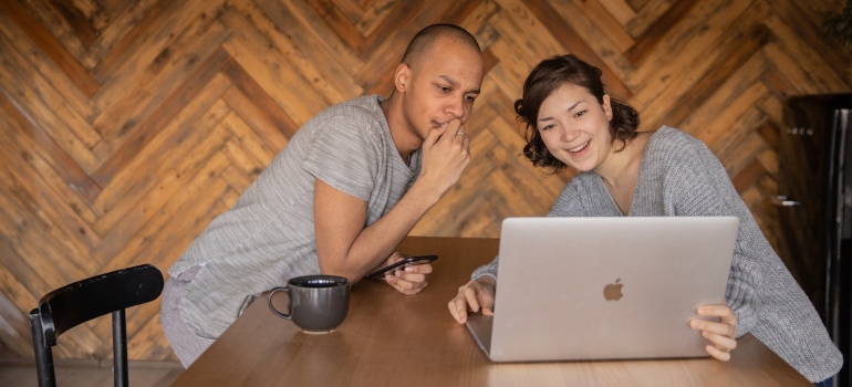 Couple researching should couples go to PA rehab together on a laptop