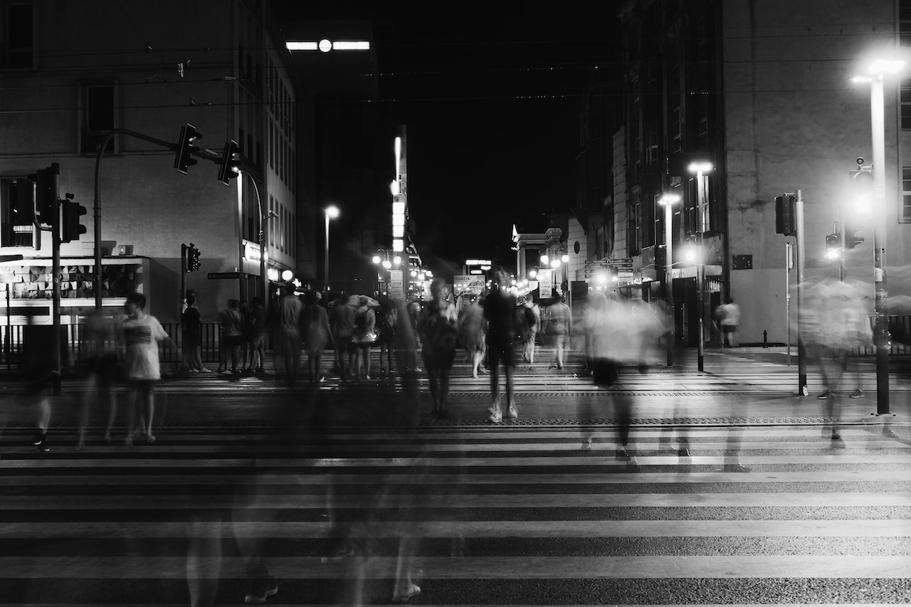 a black and white street with people