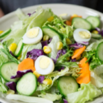 A person holding a salad bowl, showing how building a supportive sober social cycle in Pennsylvania is possible through proper nutrition.
