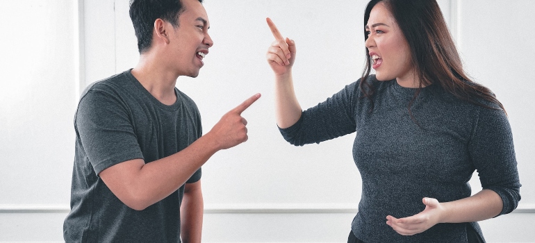 Picture of a couple who is arguing about a loved one who refuses to acknowledge their addiction