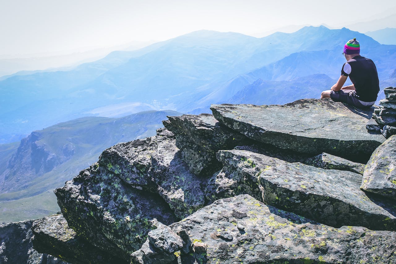 a man sitting on the rock