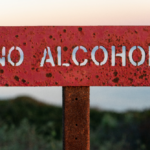a red "no alcohol" sign representing risks and dangers of quitting alcohol cold turkey