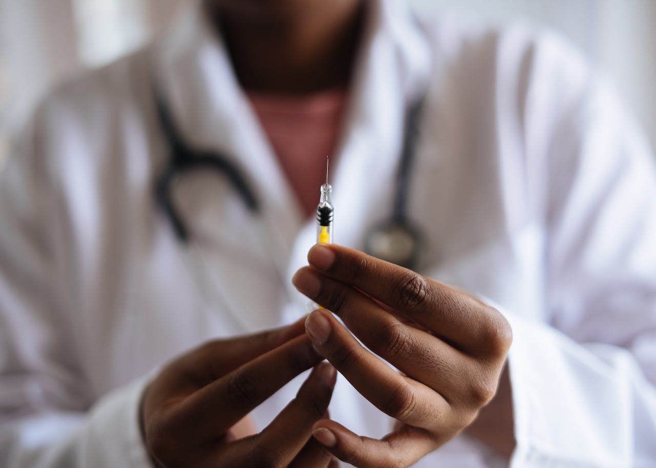 a medical professional holding a syringe as a sign to what you should know about Tranq