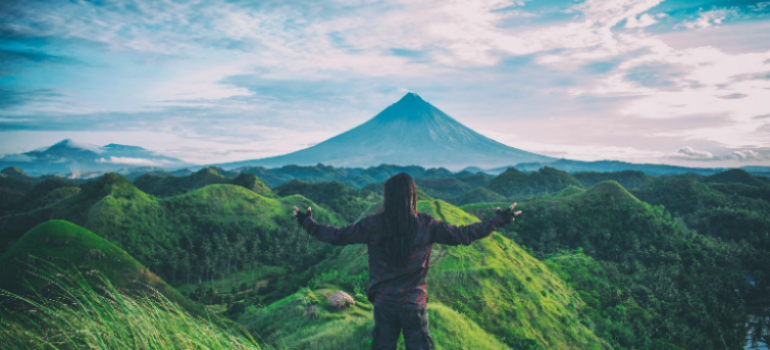 a free woman in nature representing adventure therapy for substance abuse in Little Creek