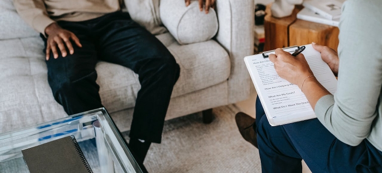 A man in therapy with a psychologist. 