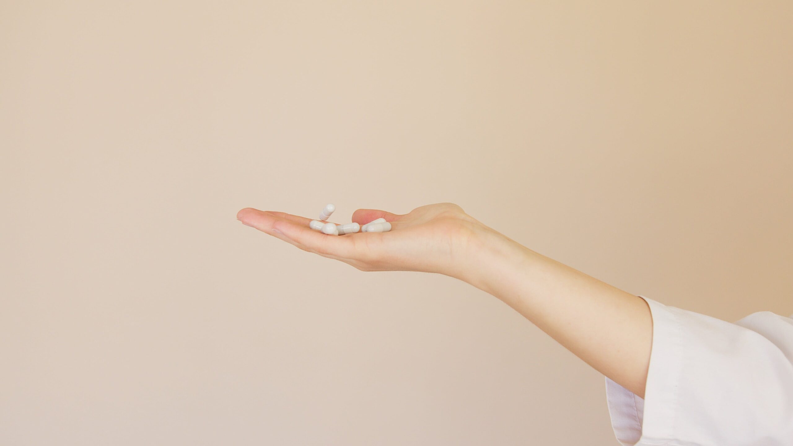 White pills on a palm
