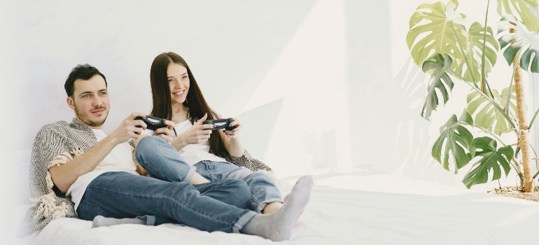 A man and a woman playing video games because of Non-Substance-Related Addictions in PA