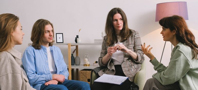 People having a discussion in group therapy.