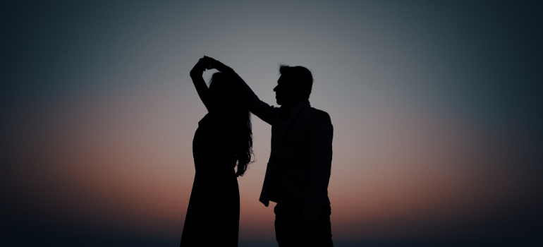 a couple dancing in the sunrise wondering can two addicts have a healthy relationship
