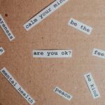 mental health messages on a brown board