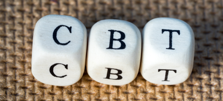 Dices spelling out CBT.