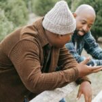 A father talking to son about the impact of parental addiction on child development in PA