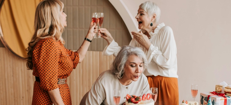 Three women celebrating a birthday