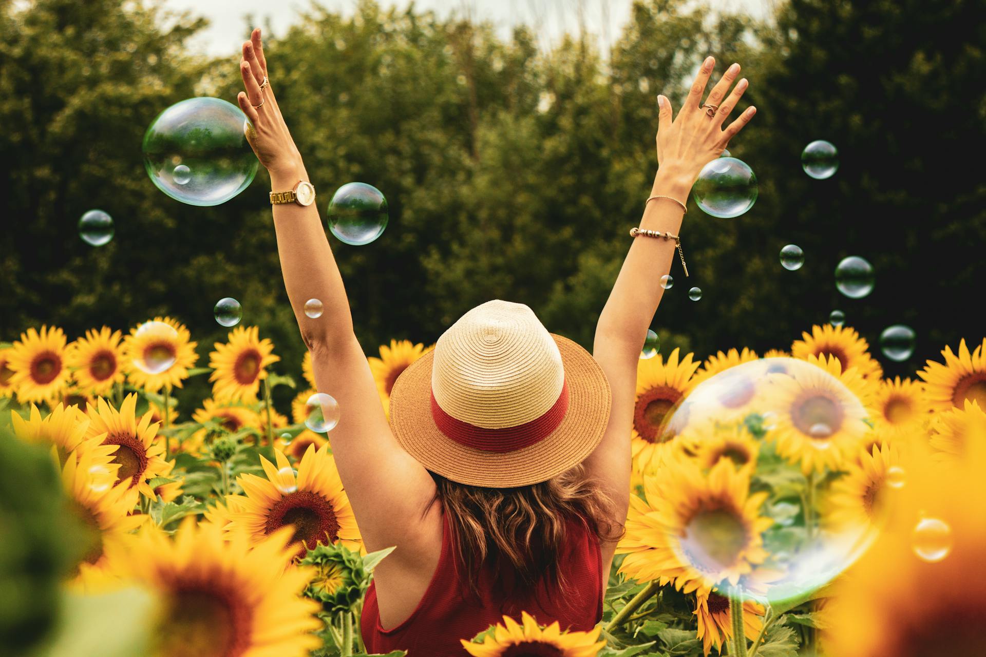 a girl in a sunflower field enjoying Summer Social Activities in PA Without Alcohol