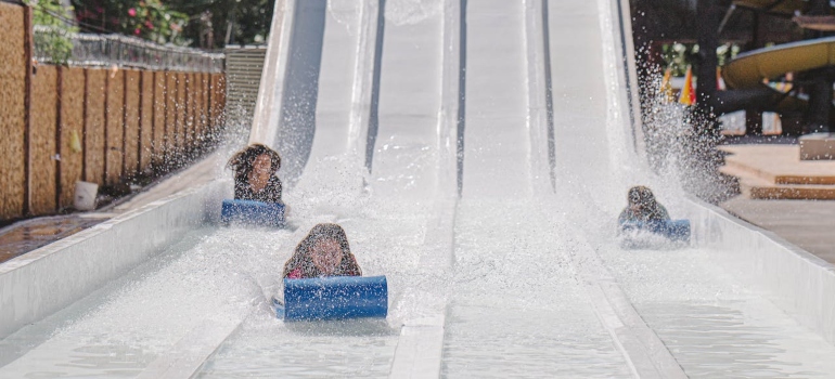 children on a water slide enjoying Summer Social Activities in PA Without Alcohol