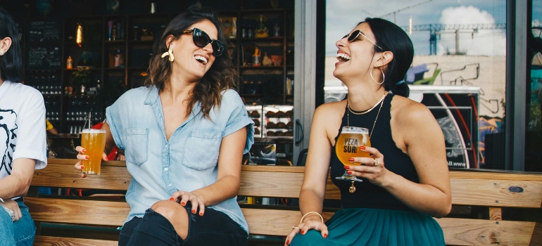 Two women drinking beer