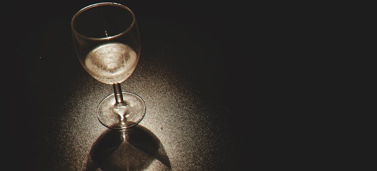 Glass of wine on a black table.