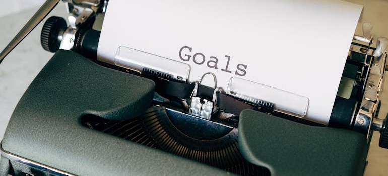 The word 'goals' written on a typewriter.