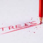 The word stress written in red ink.