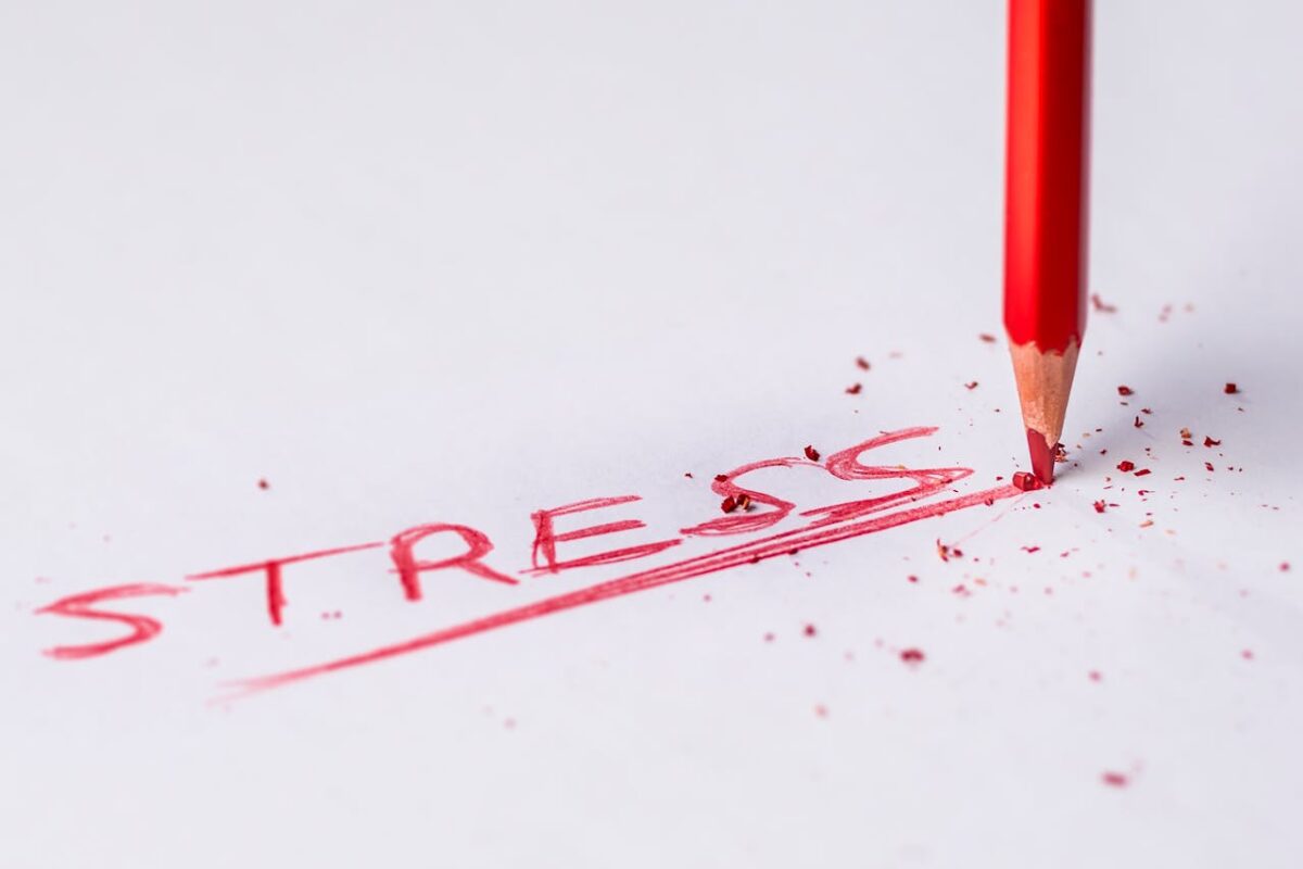 The word stress written in red ink.
