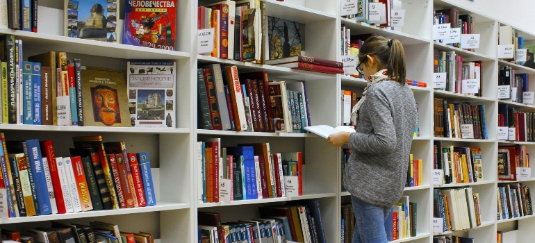 A woman in a library reading about marijuana abuse in Pennsylvania 