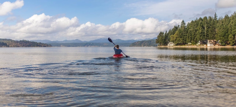 a man kayaking on the lake