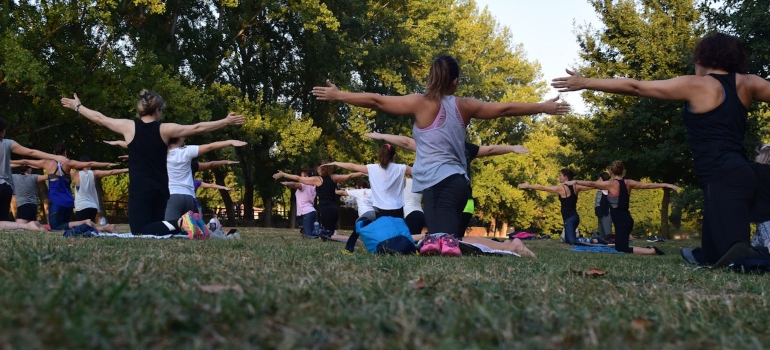 many women in a fitness class in the park 