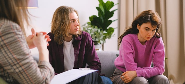 A Couple Having an Counseling to a Woman