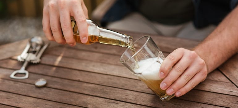 a man pouring a bier 