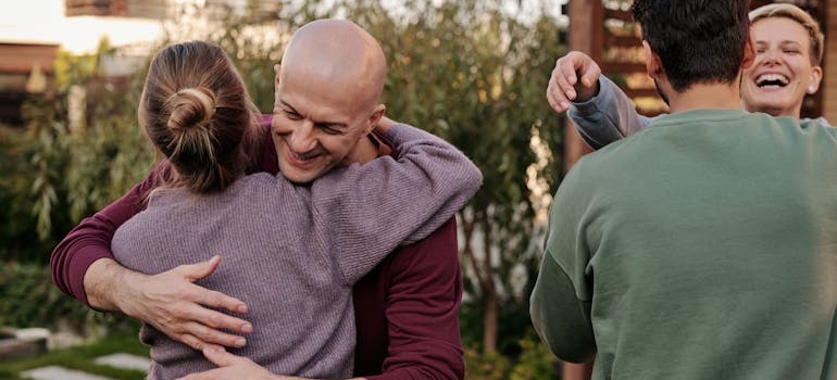 Family hugging at a family gathering.