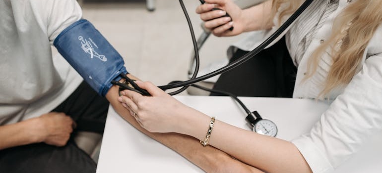 Doctor measuring a patient's blood pressure.