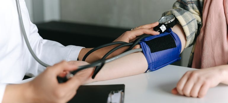 Person getting their blood pressure measured.